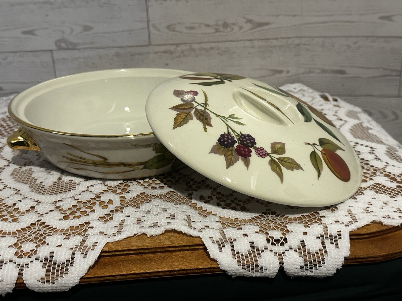 Set of three Royal Worcester Evesham Gold porcelain serving dishes with lids.
