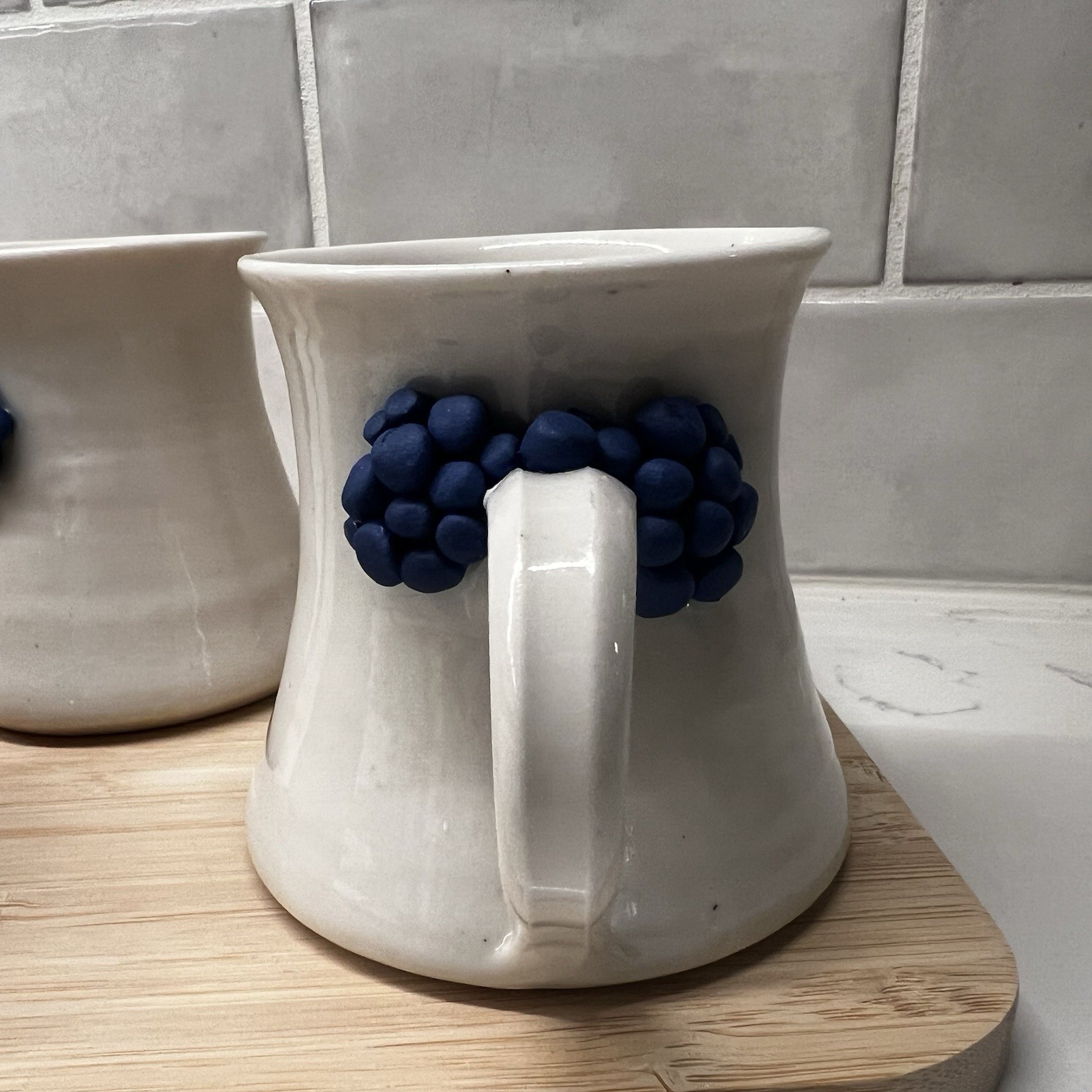3 Handmade Pottery Mugs with blue grape design around handle, signed by artist