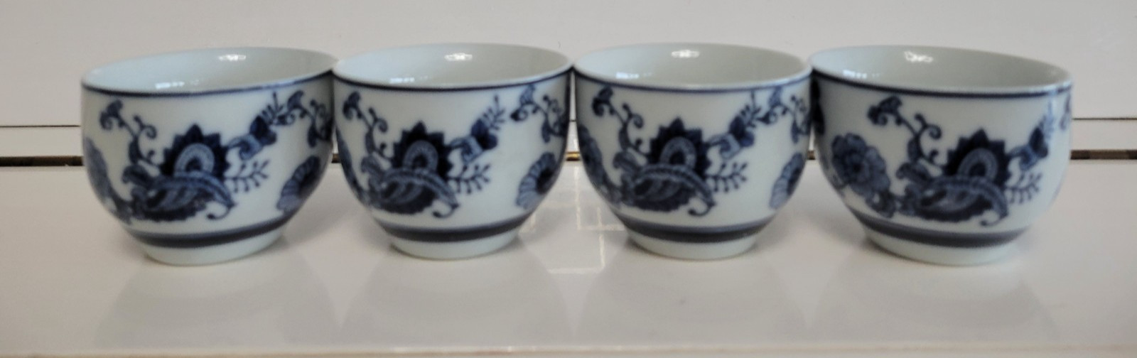 4 PIER 1 IMPORTS PORCELAIN TEA CUPS WHITE AND BLUE 2.25 INCHES HOLDS 6 OZS