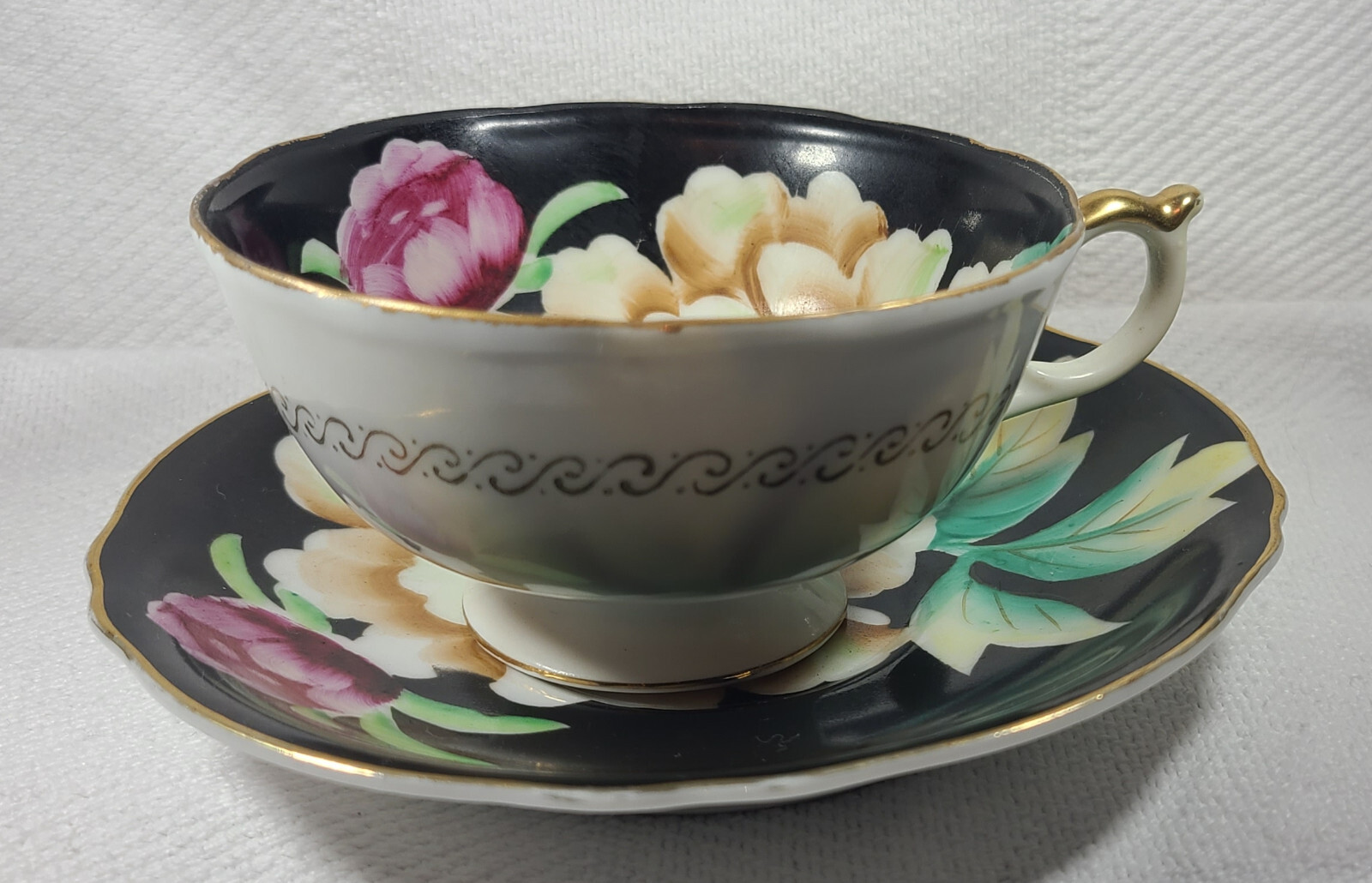 Hand Painted Orion Teacup and Saucer Made in Occupied Japan Black w/ Flowers