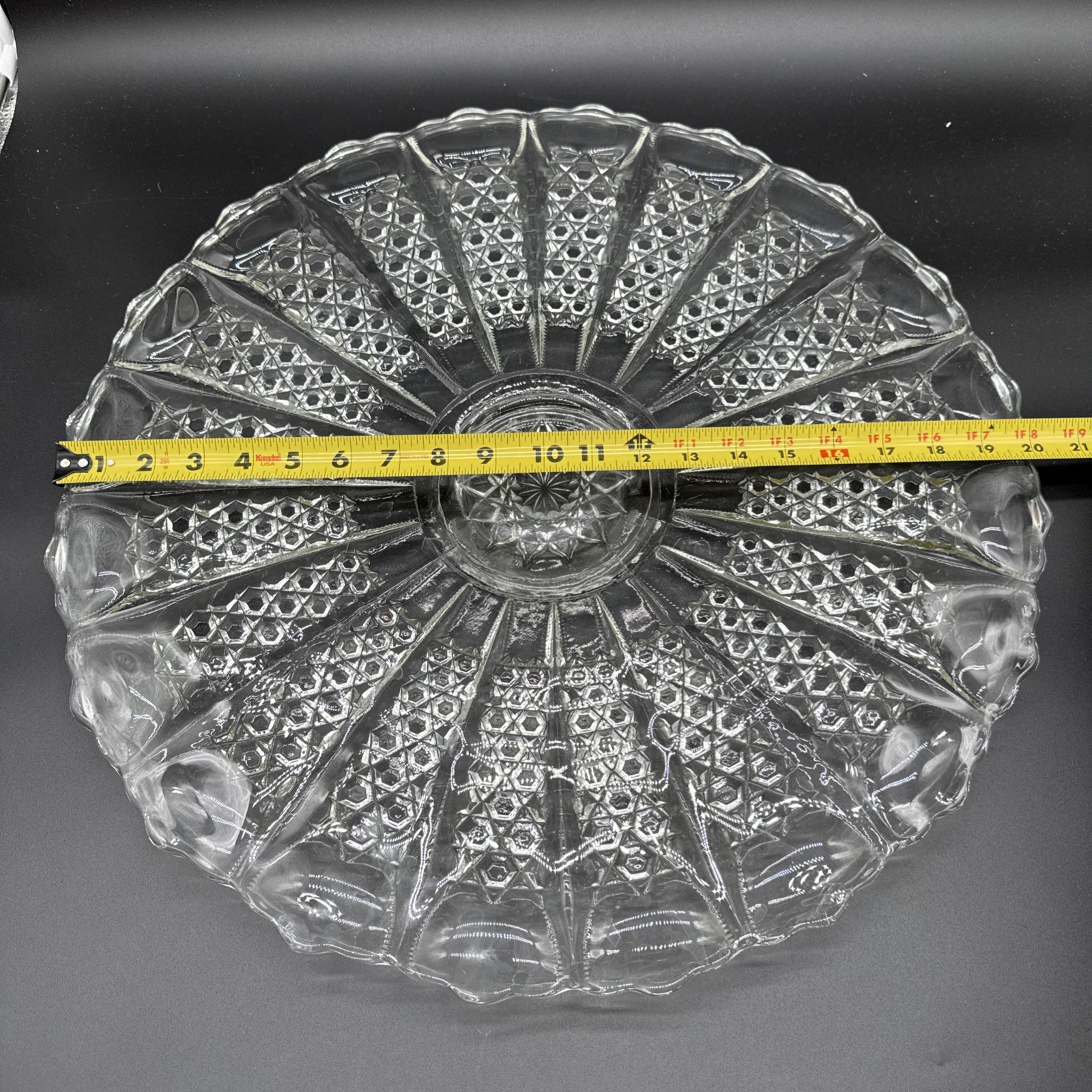 Cut crystal glass plate with radial diamond pattern