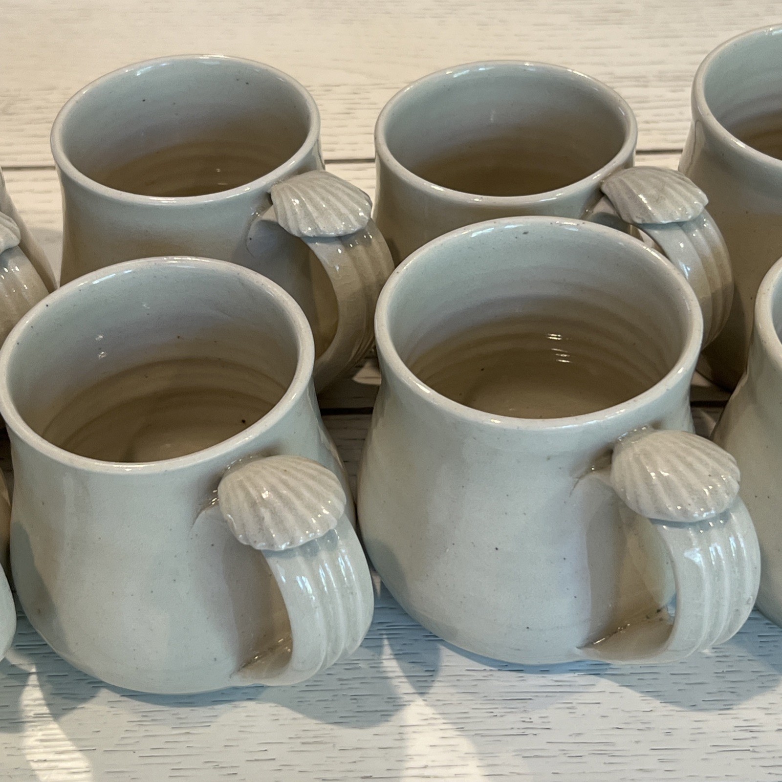 8 Pc Hand Thrown Beige Clay Pottery Coffee Tea Mugs Seashell Handle Stamped Set