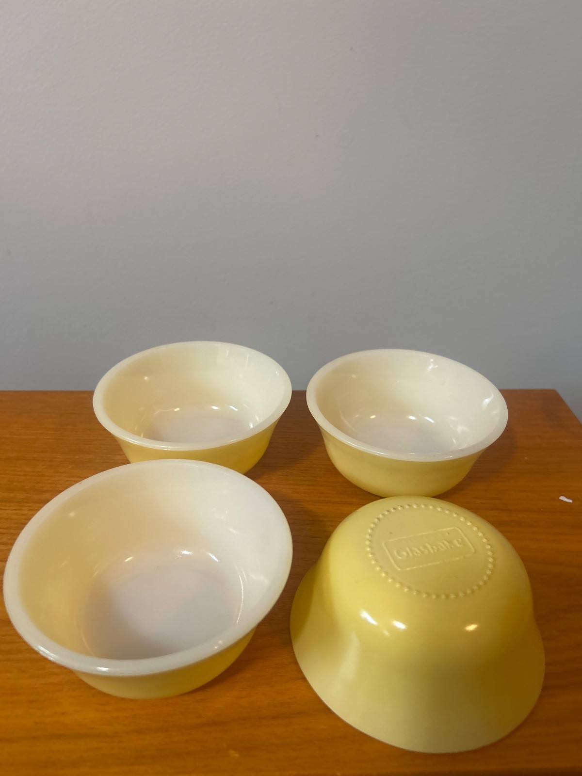 Set-4 vintage Glasbake milk glass vibrant yellow bowls from the mid-century era.
