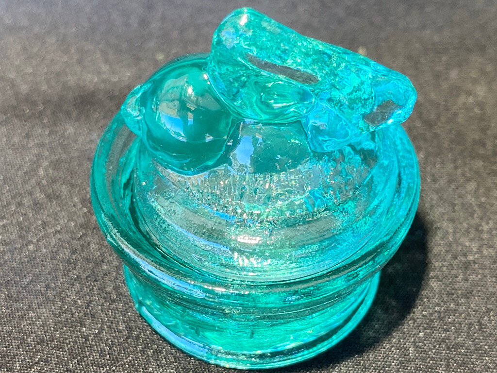 Green Vaseline uranium glass bunny rabbit on nest basket Easter glows teal blue