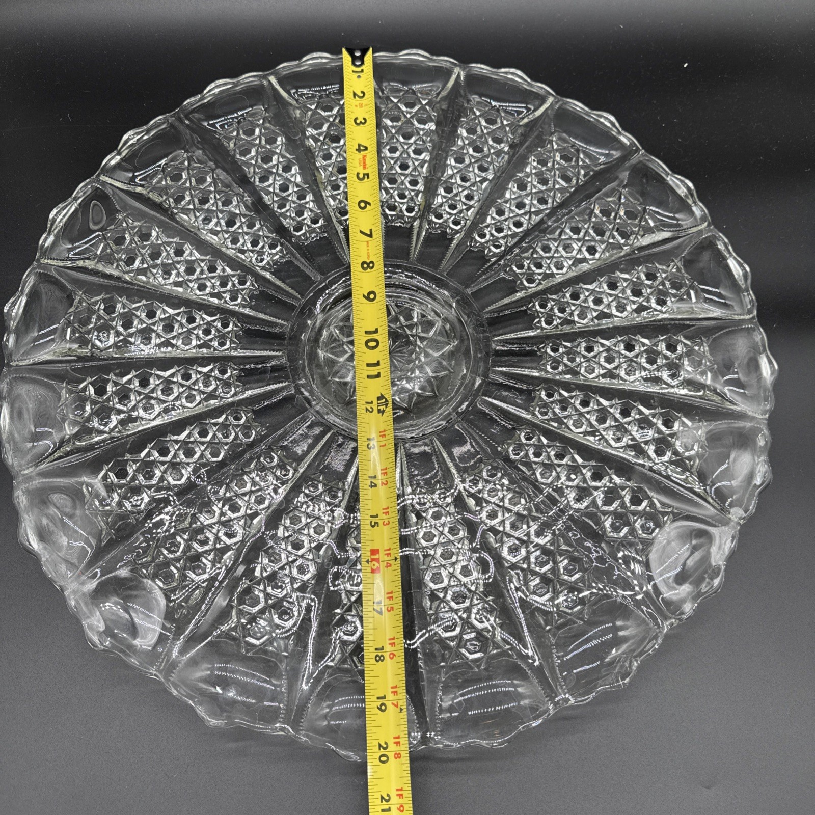 Cut crystal glass plate with radial diamond pattern