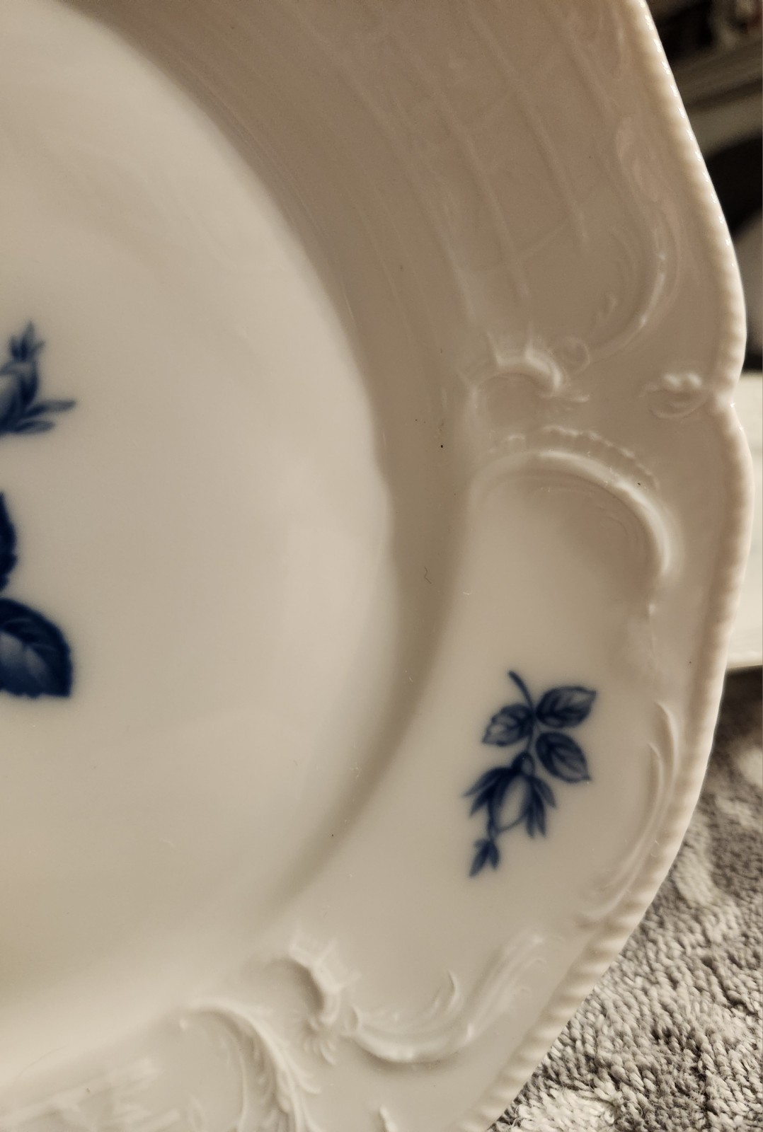 A set of 6 Rosenthal Sanssouci Blue Rose porcelain plates with embossed rims.