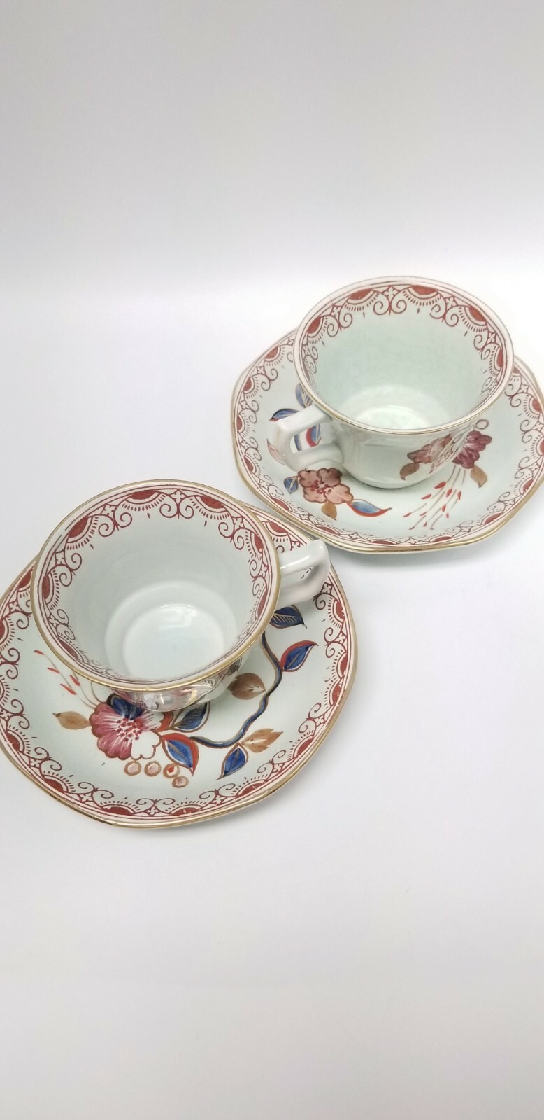 Calyx Ware hand painted 2 teacup saucer set gold light green rust blue England
