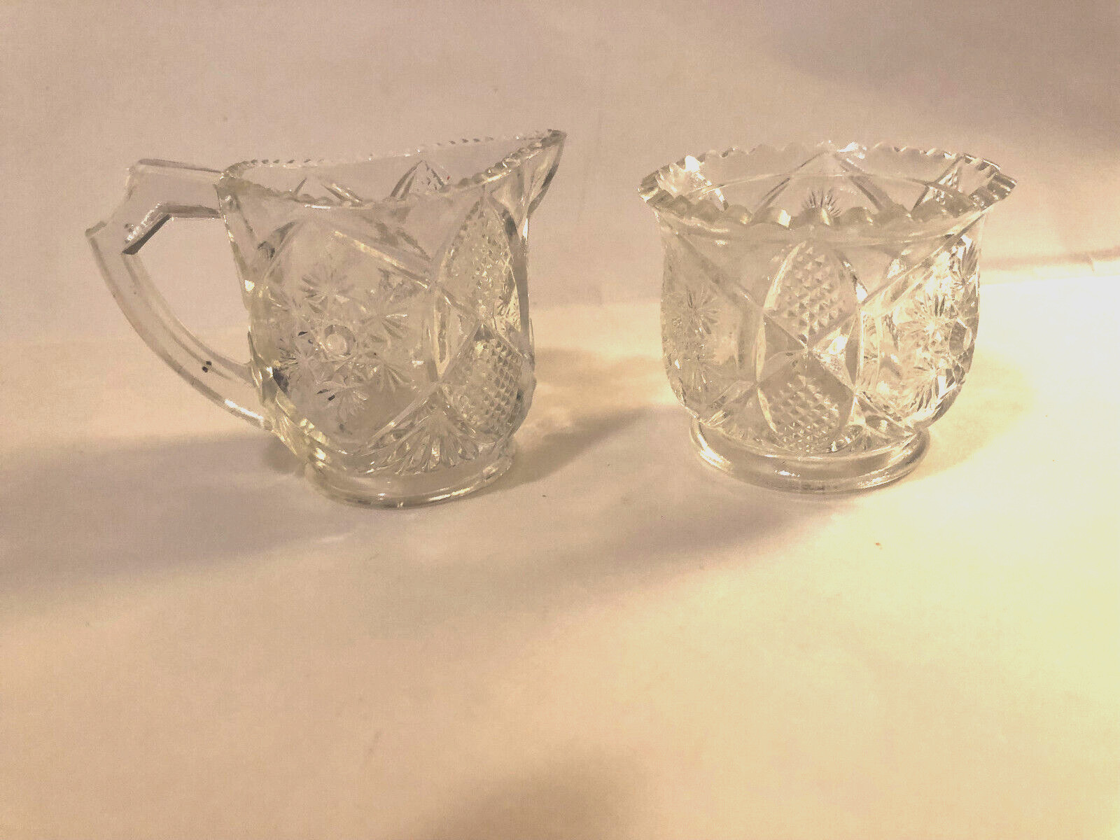 ANTIQUE GLASS CHILDREN’S TOY CREAMER AND HANDLED SUGAR BOWL- SNOWFLAKE DESIGN