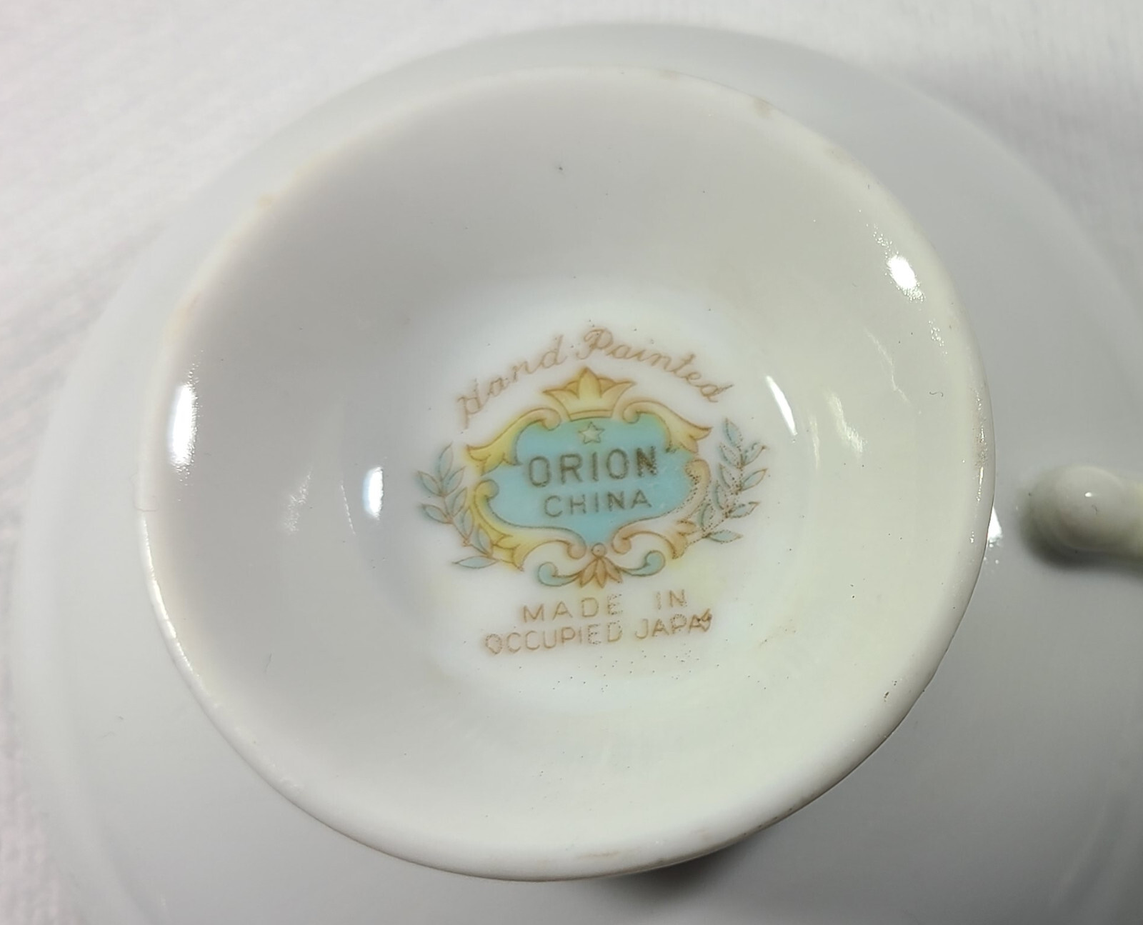 Hand Painted Orion Teacup and Saucer Made in Occupied Japan Black w/ Flowers