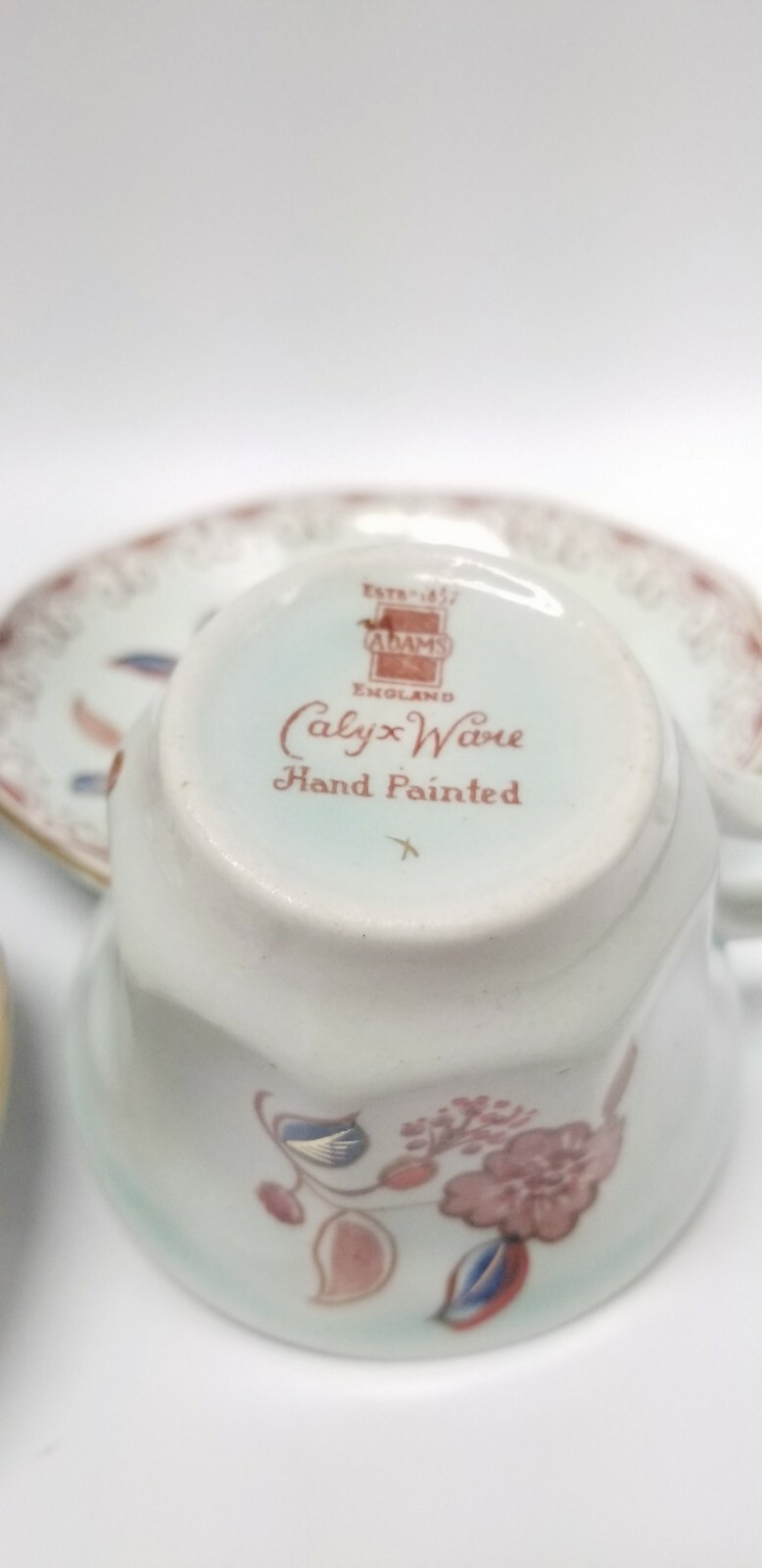 Calyx Ware hand painted 2 teacup saucer set gold light green rust blue England