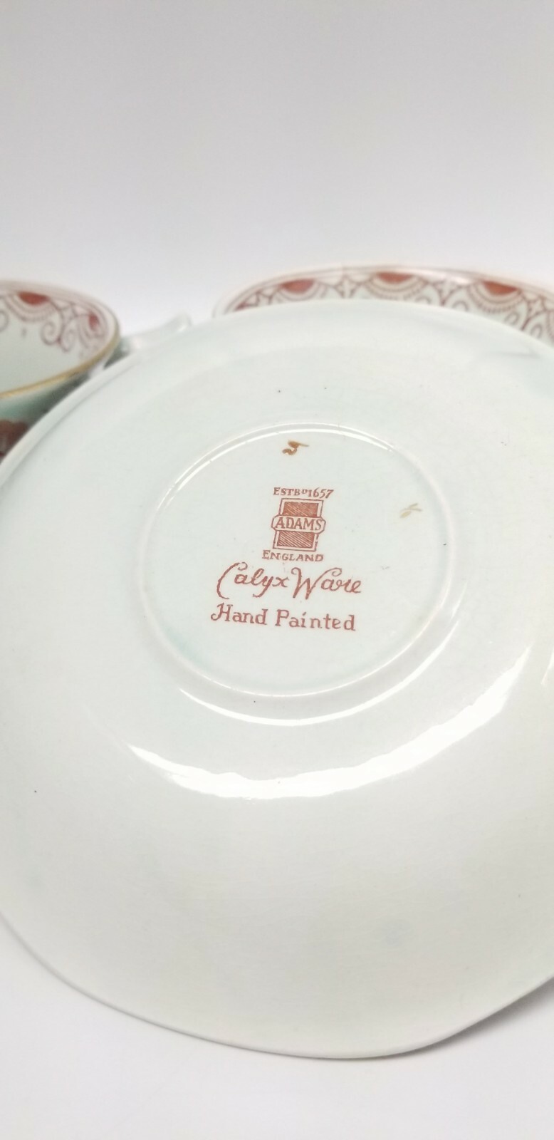 Calyx Ware hand painted 2 teacup saucer set gold light green rust blue England