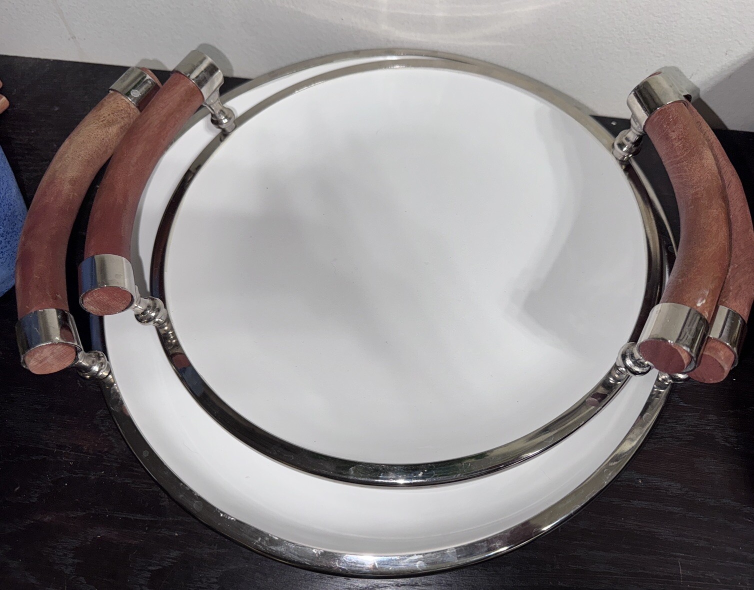 Set Of Two White Ceramic Salad Trys With Wooden Handles And Chrome Rims.