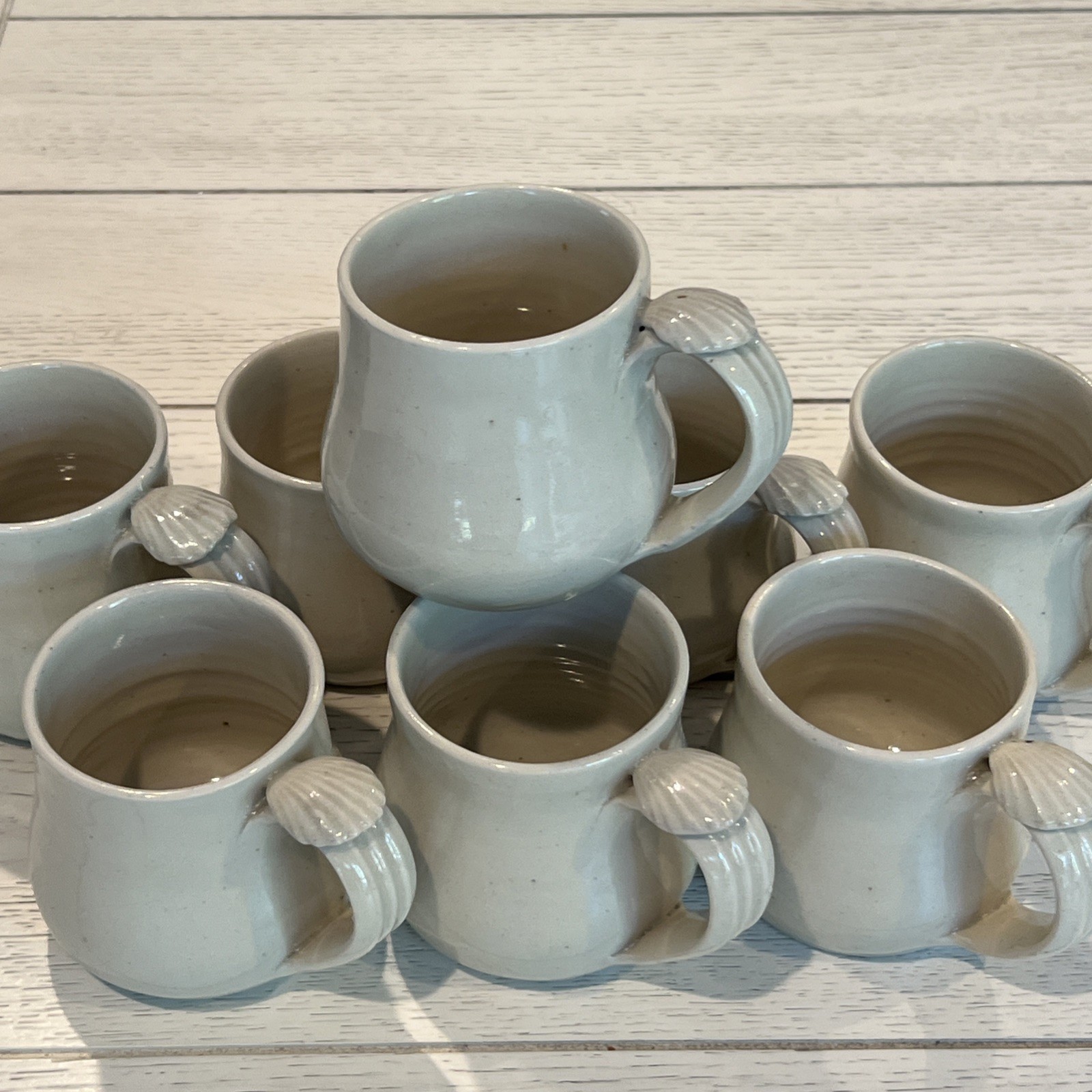 8 Pc Hand Thrown Beige Clay Pottery Coffee Tea Mugs Seashell Handle Stamped Set