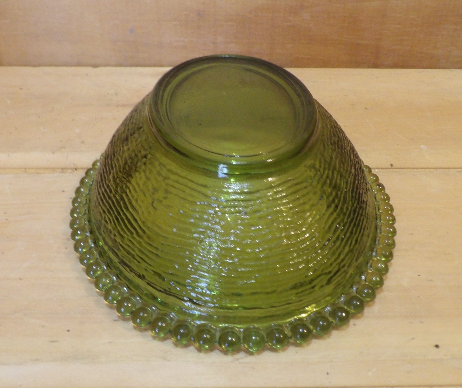 1 Indiana Glass Olive Green Hen on a Nest. 7″L x 5½”W x 5¼”H. There is one Chip