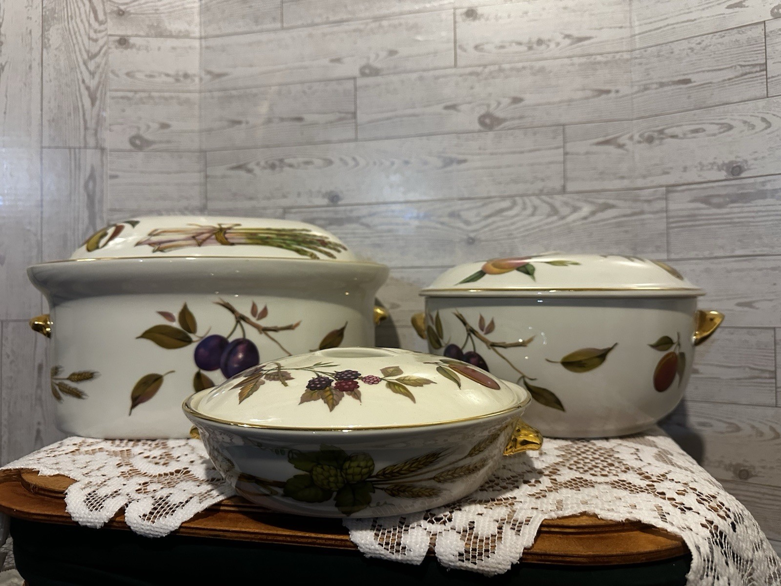 Set of three Royal Worcester Evesham Gold porcelain serving dishes with lids.