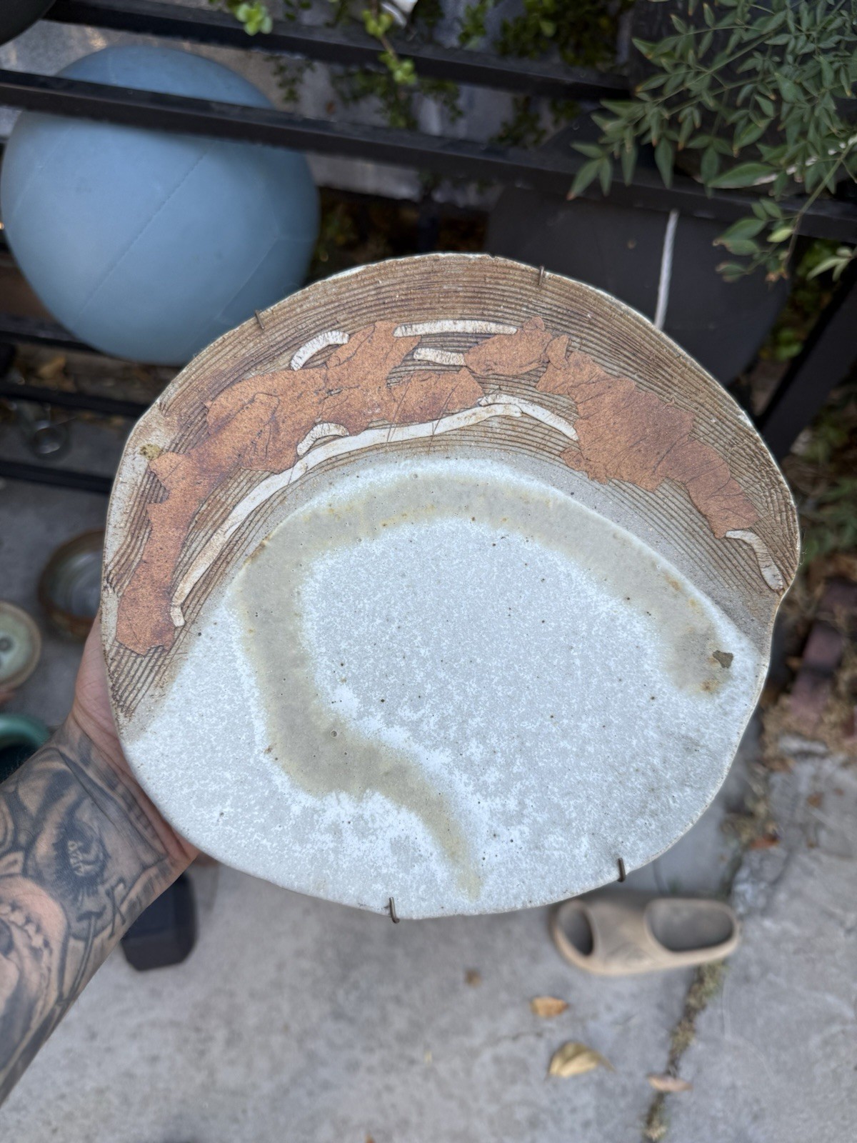 handcrafted studio art pottery plate, likely featuring a textured, unglazed exte
