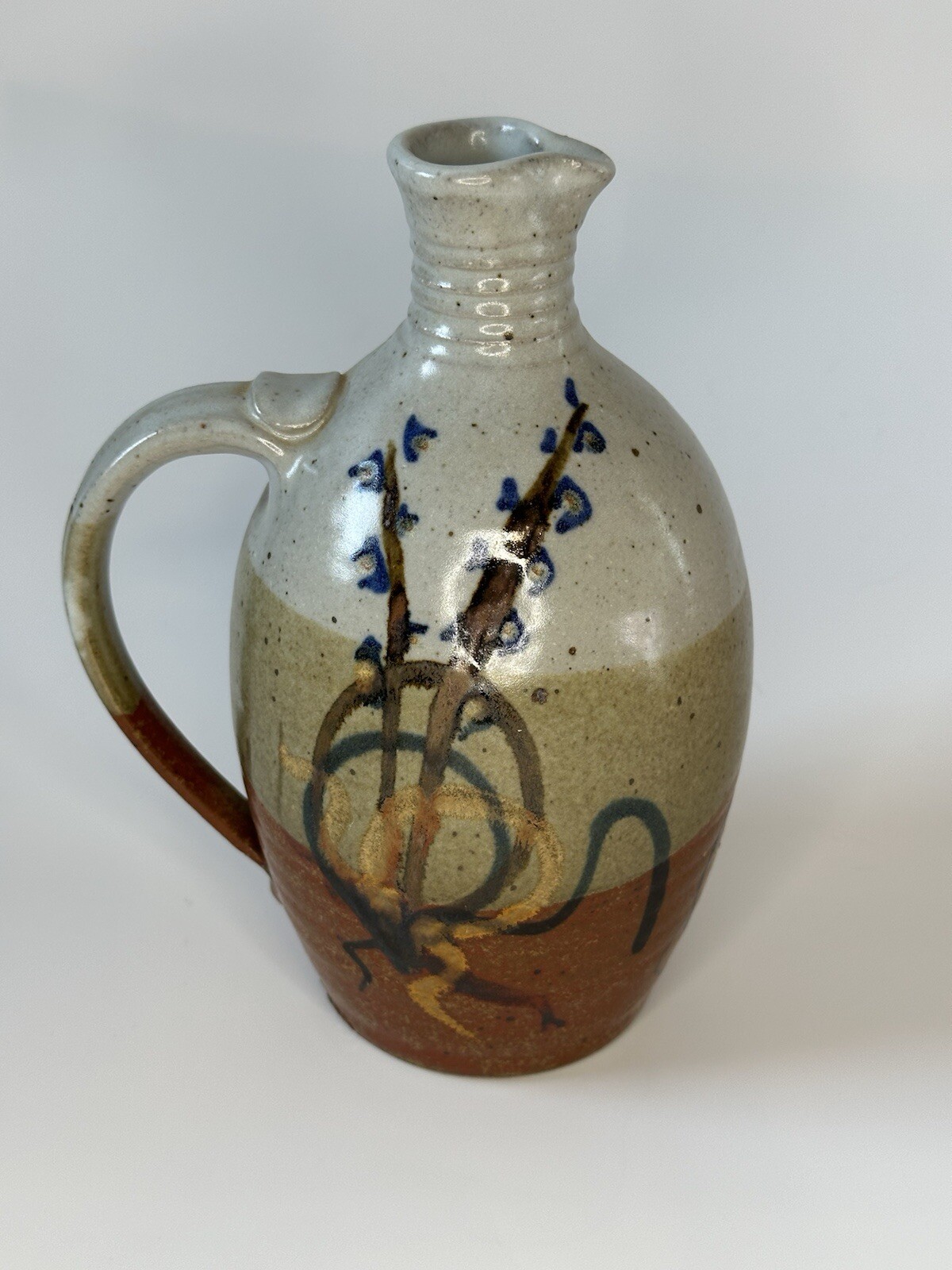 Signed AM stoneware jug, gray, tan, rust, blue, brown. Earthy Natural colors.