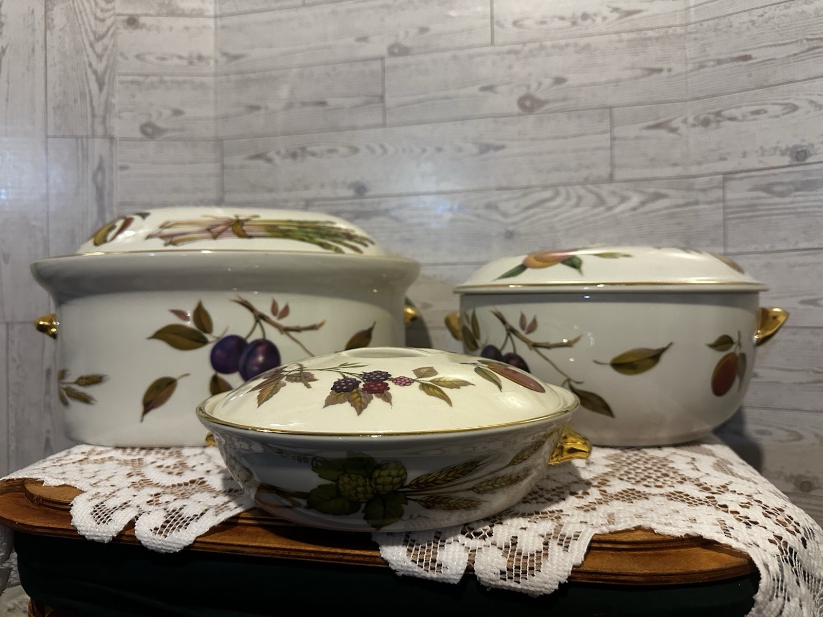 Set of three Royal Worcester Evesham Gold porcelain serving dishes with lids.