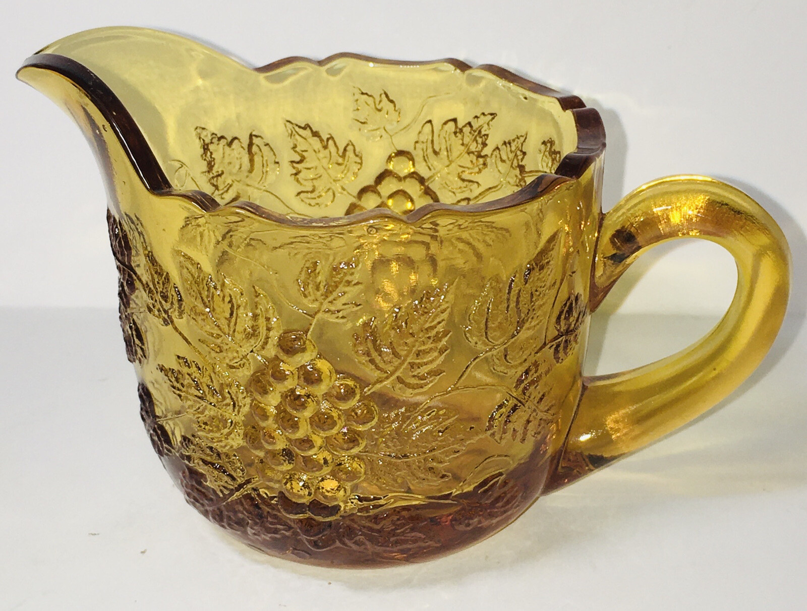 L.E smith Honey Amber pressed Depression glass grapes and leaves pattern creamer