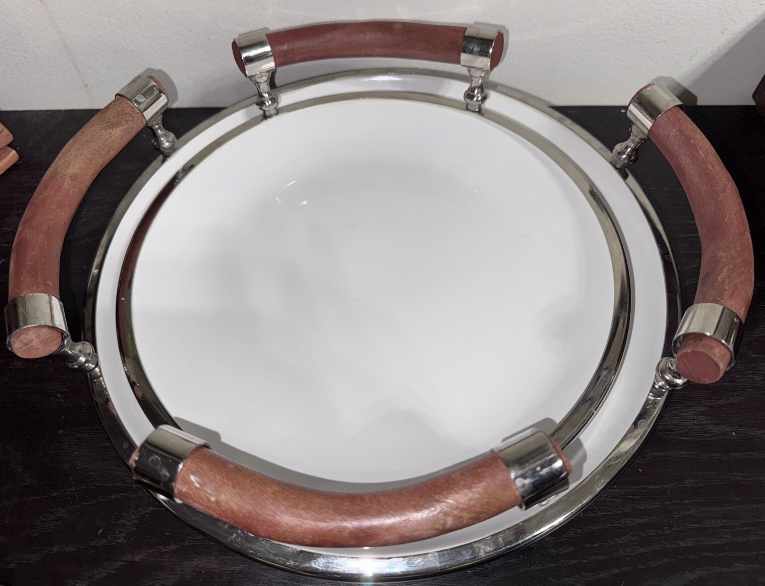 Set Of Two White Ceramic Salad Trys With Wooden Handles And Chrome Rims.