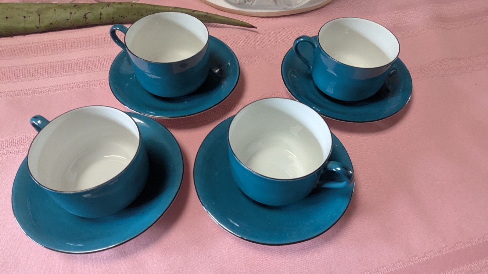 Four piece set cups saucers blue black white Germany