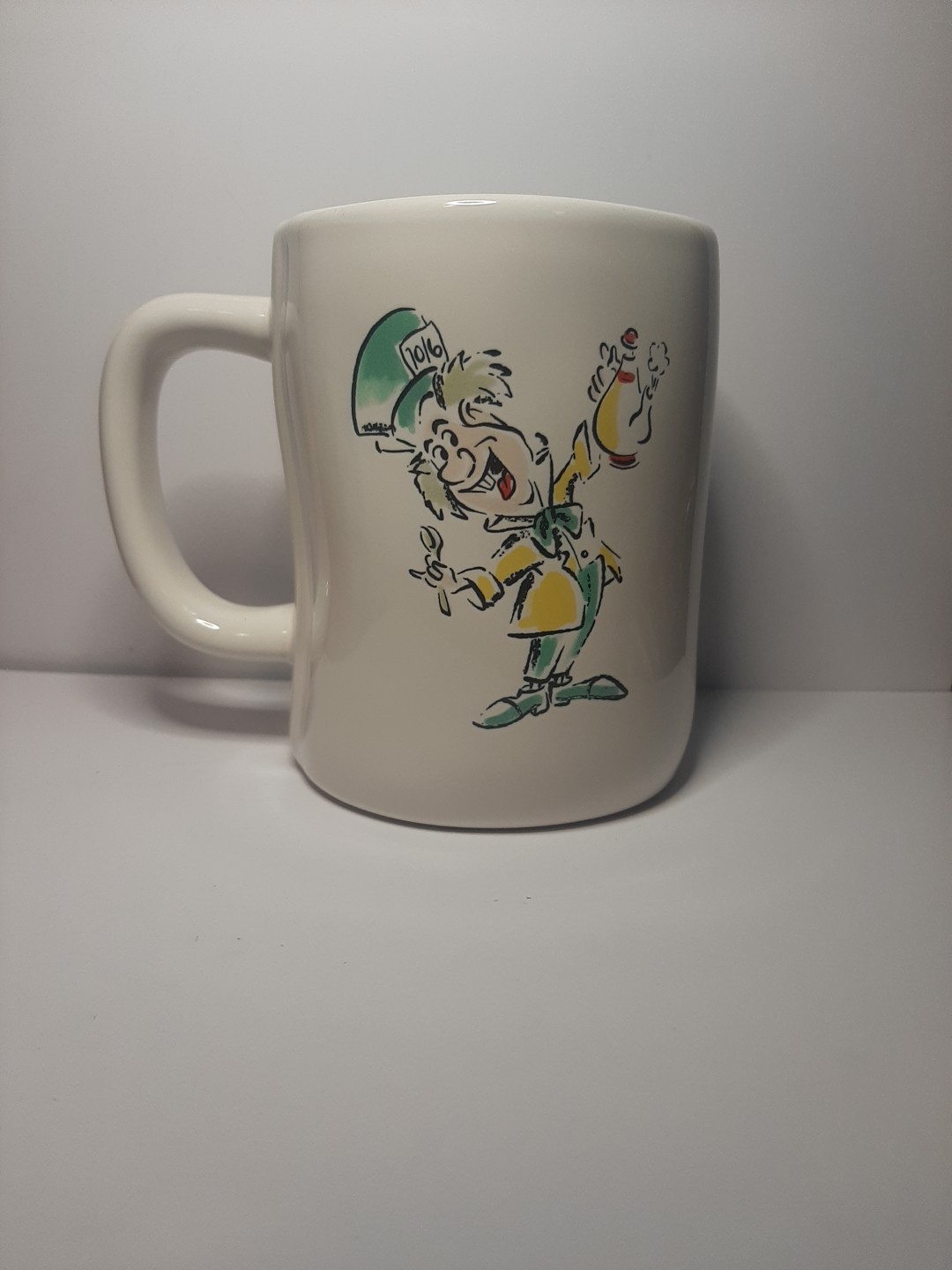 RAE DUN ” MAD TEA PARTY ” CERAMIC MUG W/MAD HATTER CHARACTER !