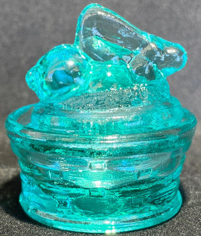 Green Vaseline uranium glass bunny rabbit on nest basket Easter glows teal blue