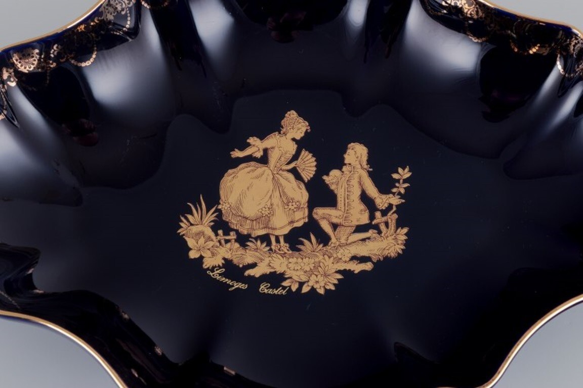 Limoges, France. Two porcelain serving platters adorned with 22-karat gold leaf