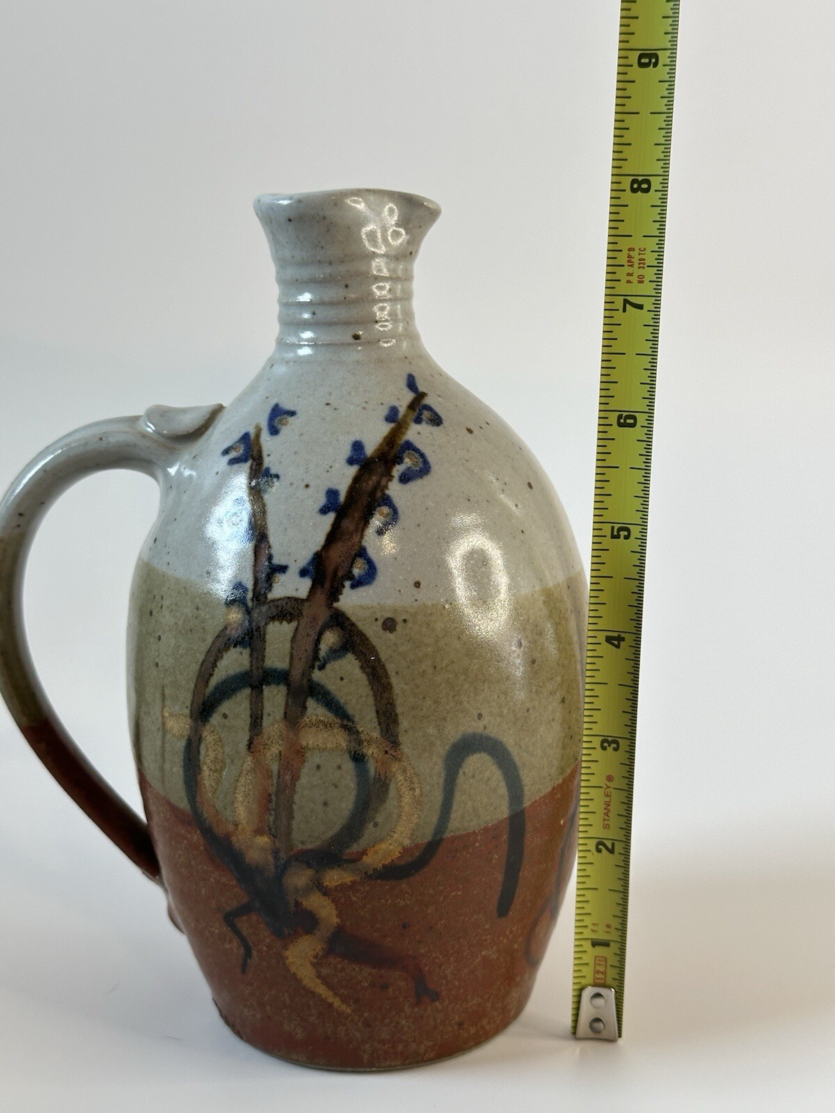 Signed AM stoneware jug, gray, tan, rust, blue, brown. Earthy Natural colors.