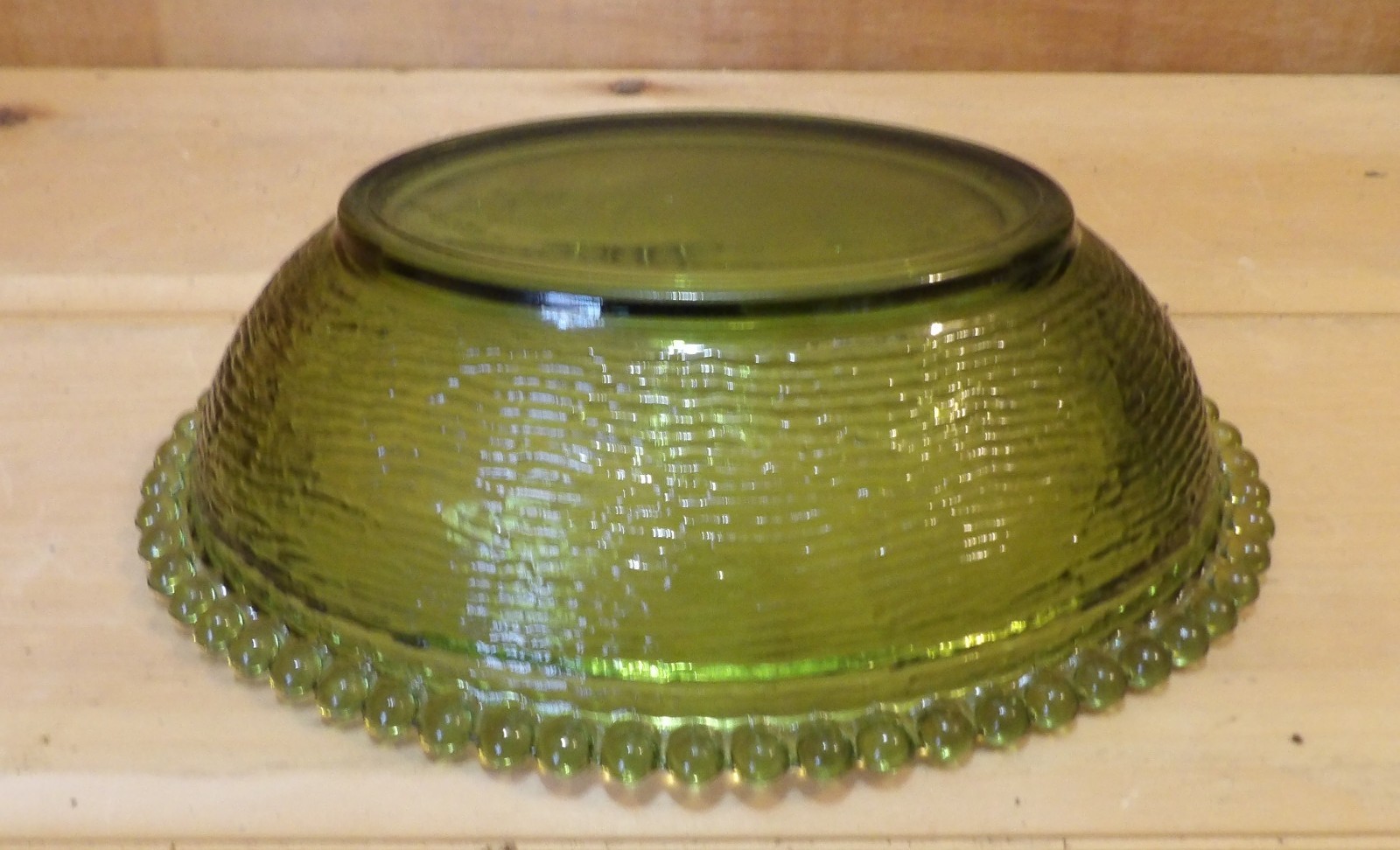 1 Indiana Glass Olive Green Hen on a Nest. 7″L x 5½”W x 5¼”H. There is one Chip
