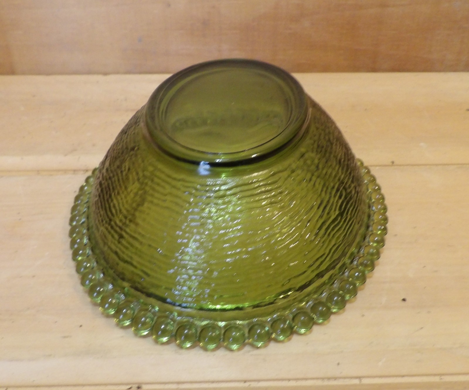 1 Indiana Glass Olive Green Hen on a Nest. 7″L x 5½”W x 5¼”H. There is one Chip