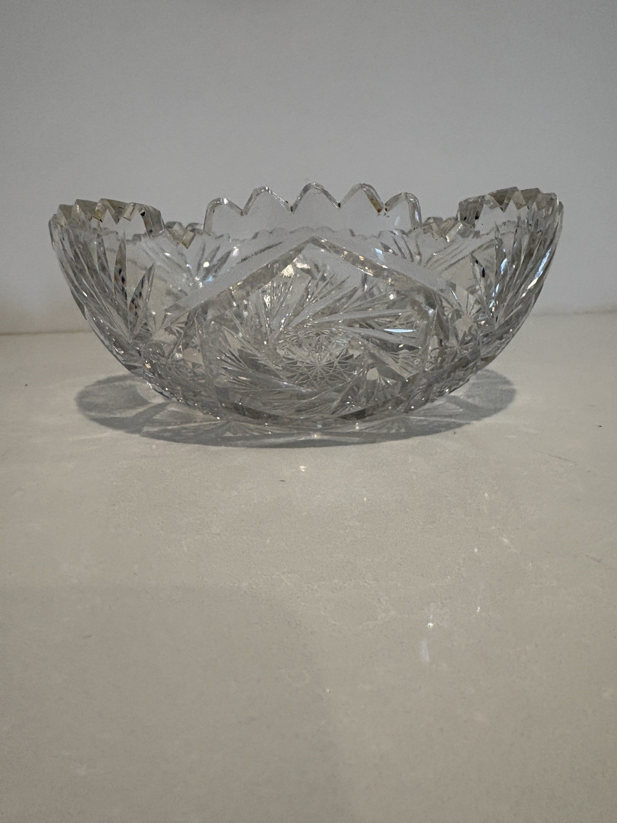 Vintage American Brilliant Cut Glass Bowl in star design w/ sawtooth edge.