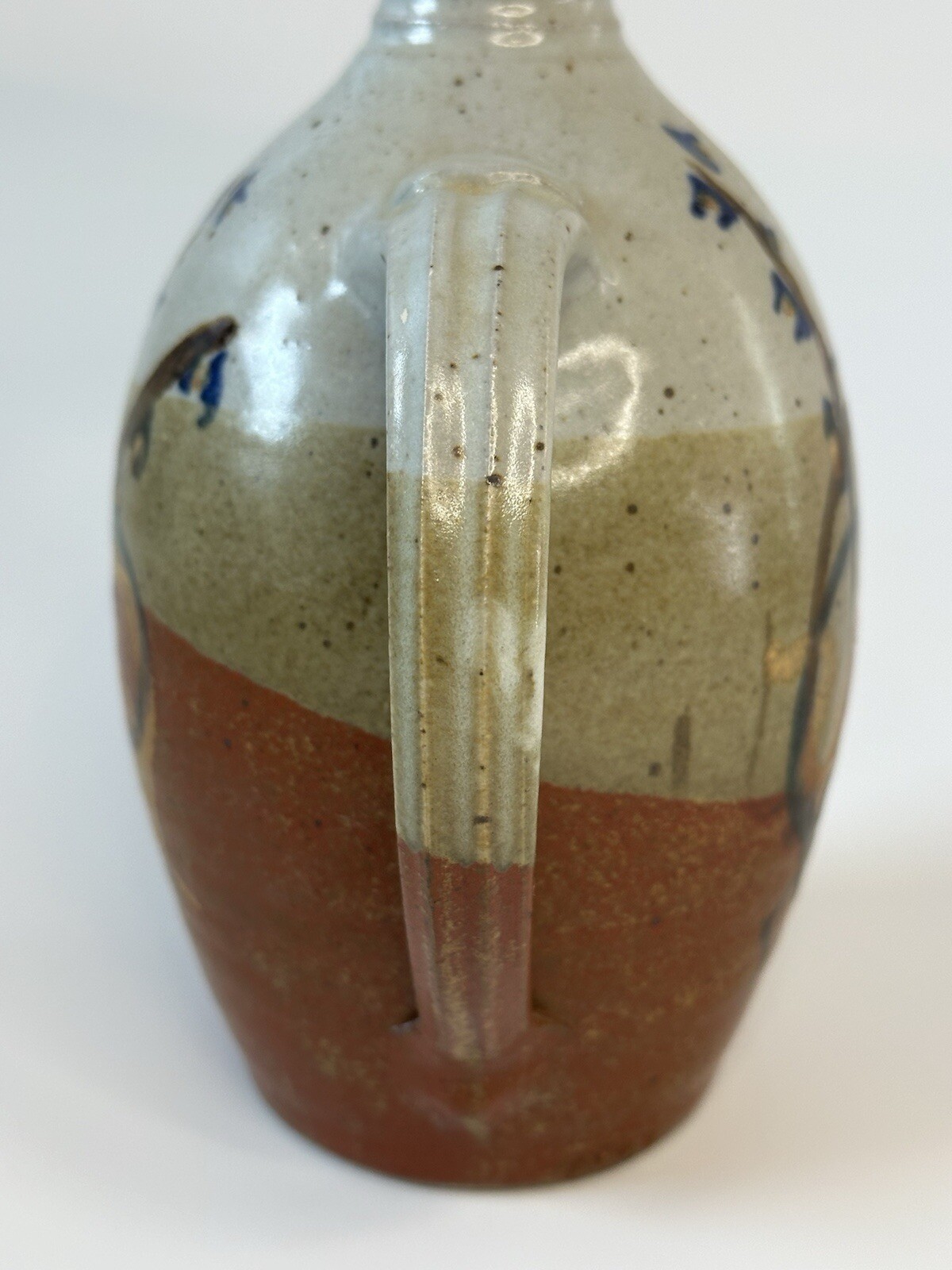 Signed AM stoneware jug, gray, tan, rust, blue, brown. Earthy Natural colors.
