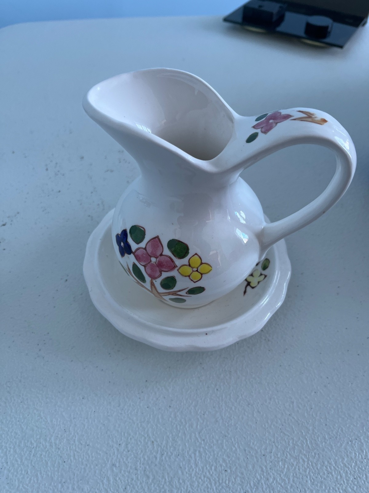 vintage porcelain creamer and saucer set