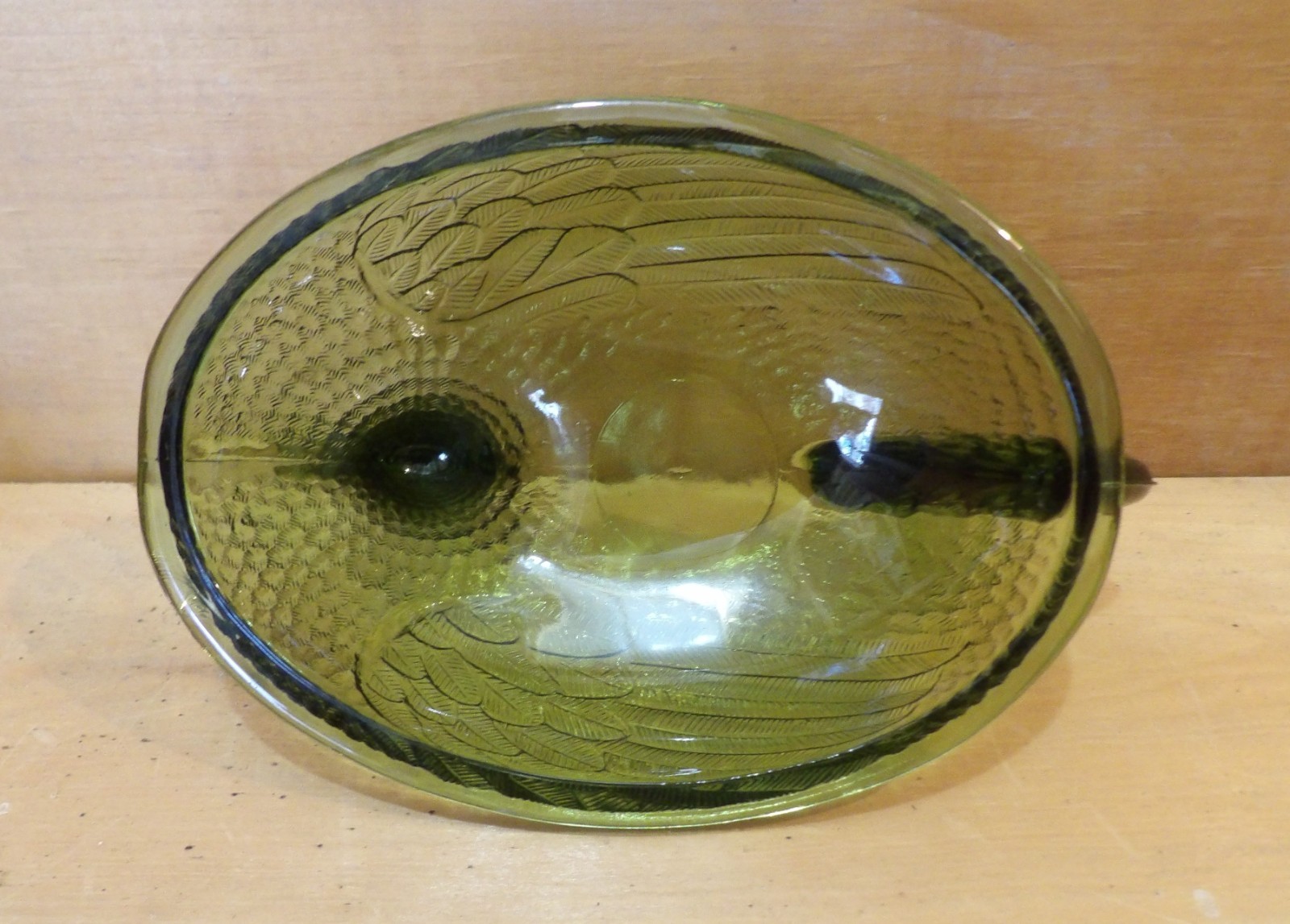 1 Indiana Glass Olive Green Hen on a Nest. 7″L x 5½”W x 5¼”H. There is one Chip