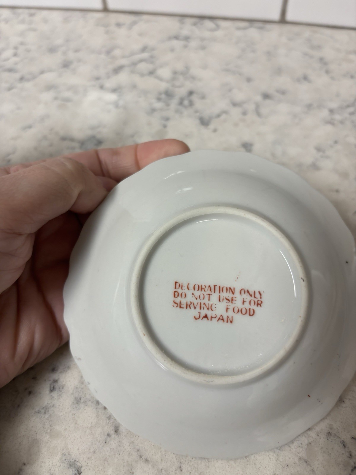 VTG porcelain creamer and saucer set with floral and butterfly. Made In Japan.