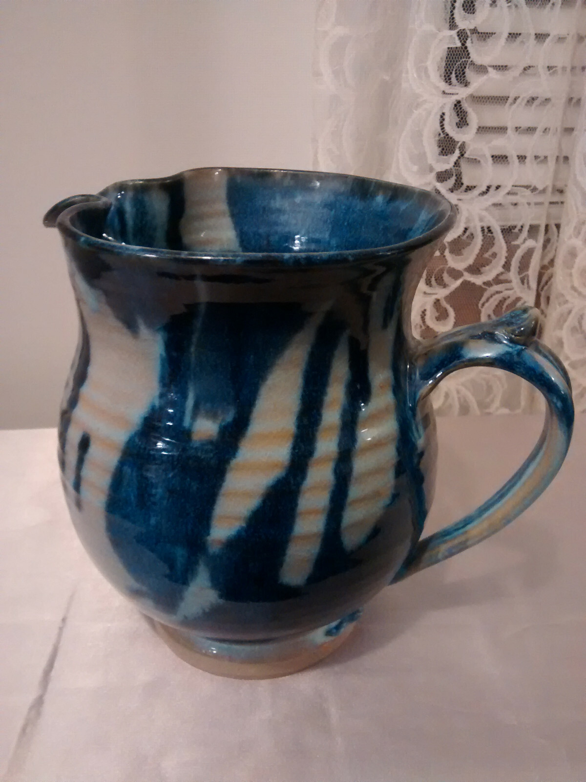 Pottery Pitcher Blue Grey Tan 7 1/4 Inches Tall Pinched Spout Thumb Rest Handle