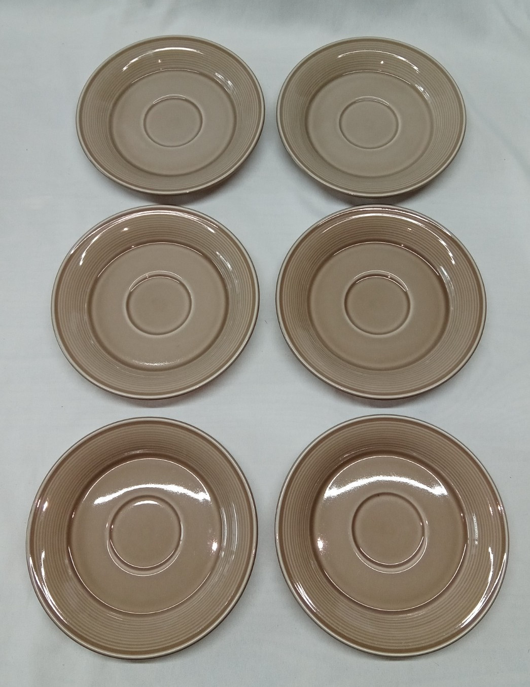 1 – Nancy Calhoun Light Brown Saucer 6 1/4″ diam. (N1)