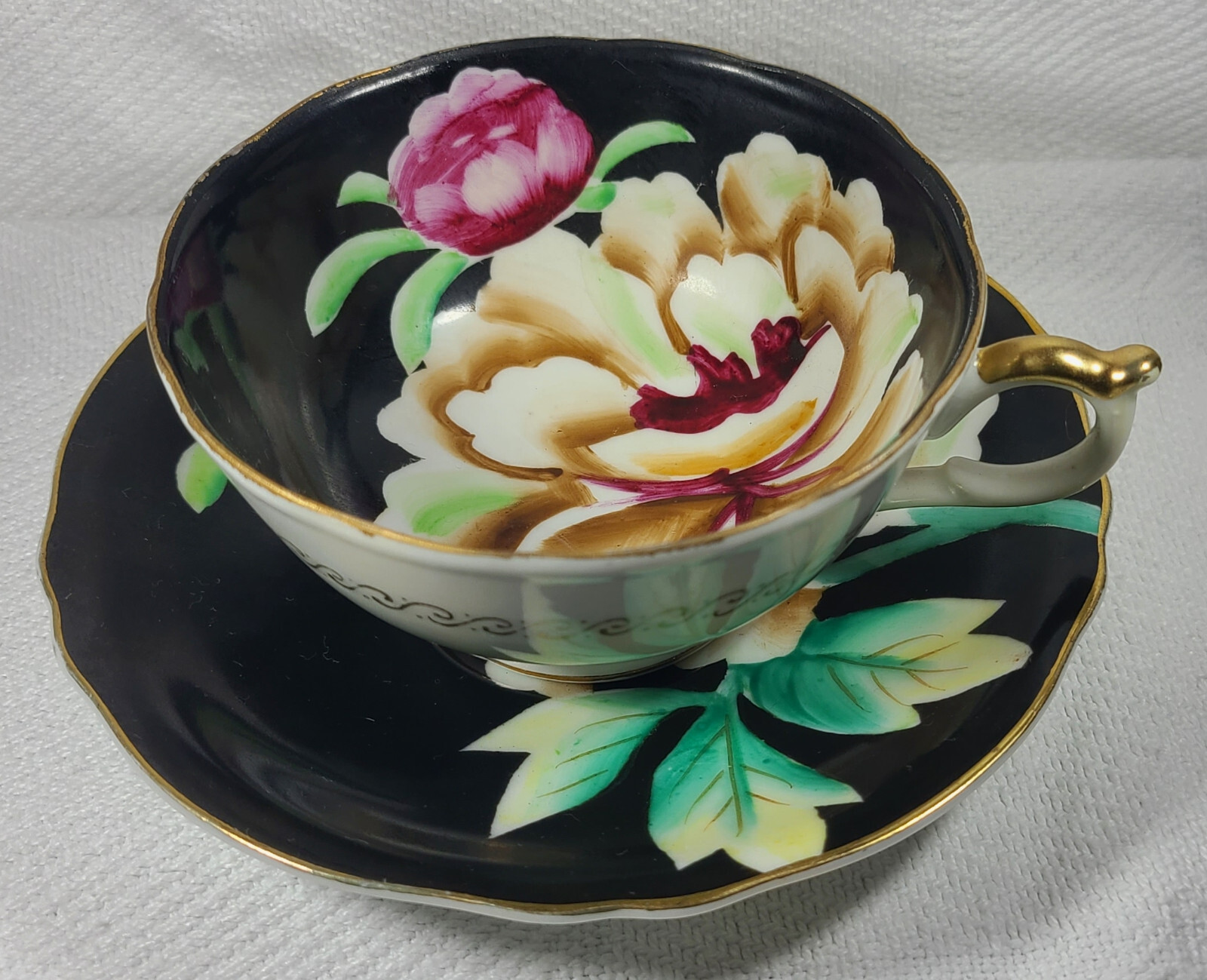 Hand Painted Orion Teacup and Saucer Made in Occupied Japan Black w/ Flowers
