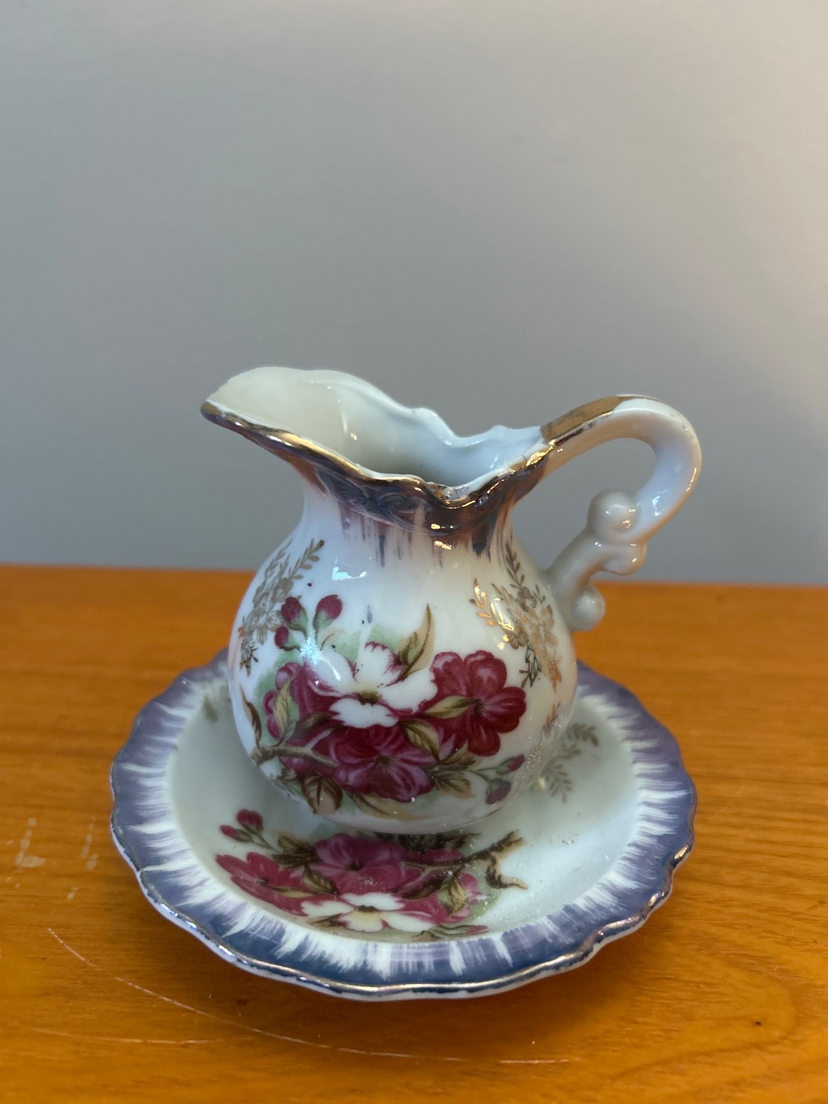 vintage Royal Crown porcelain creamer and saucer set from Japan, featuring a flo