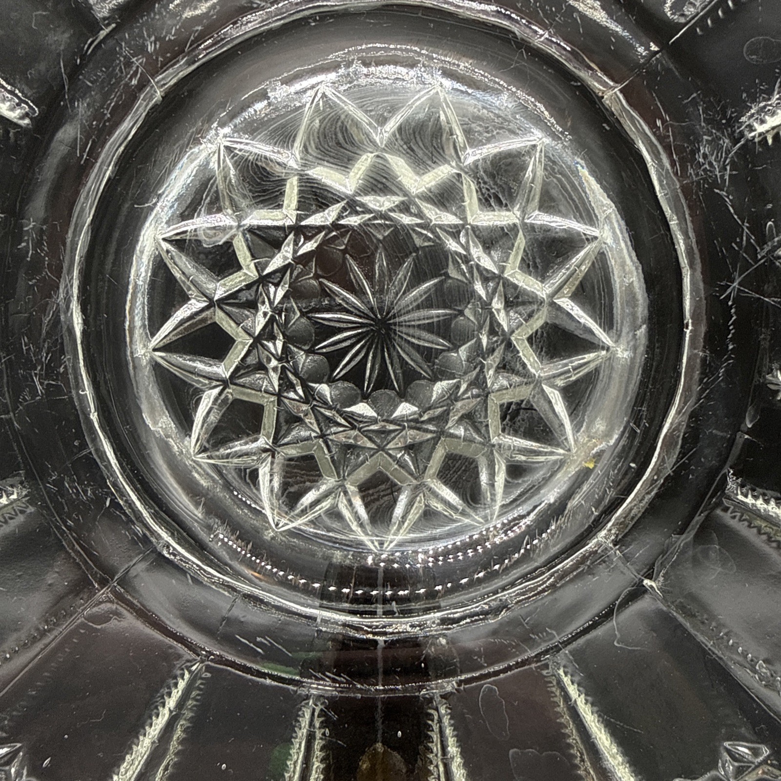 Cut crystal glass plate with radial diamond pattern