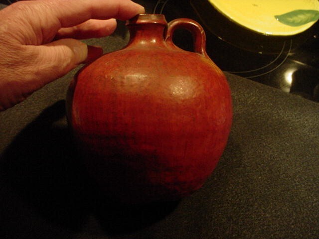 Old North Carolina Pottery jug-in a burnt orange glaze-unusual shape