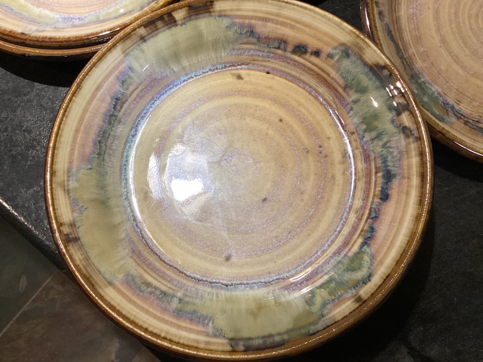 Vintage Greg Olson Handmade NINE Plates 7 1/2in Brown Rim Multicolor pre-owned