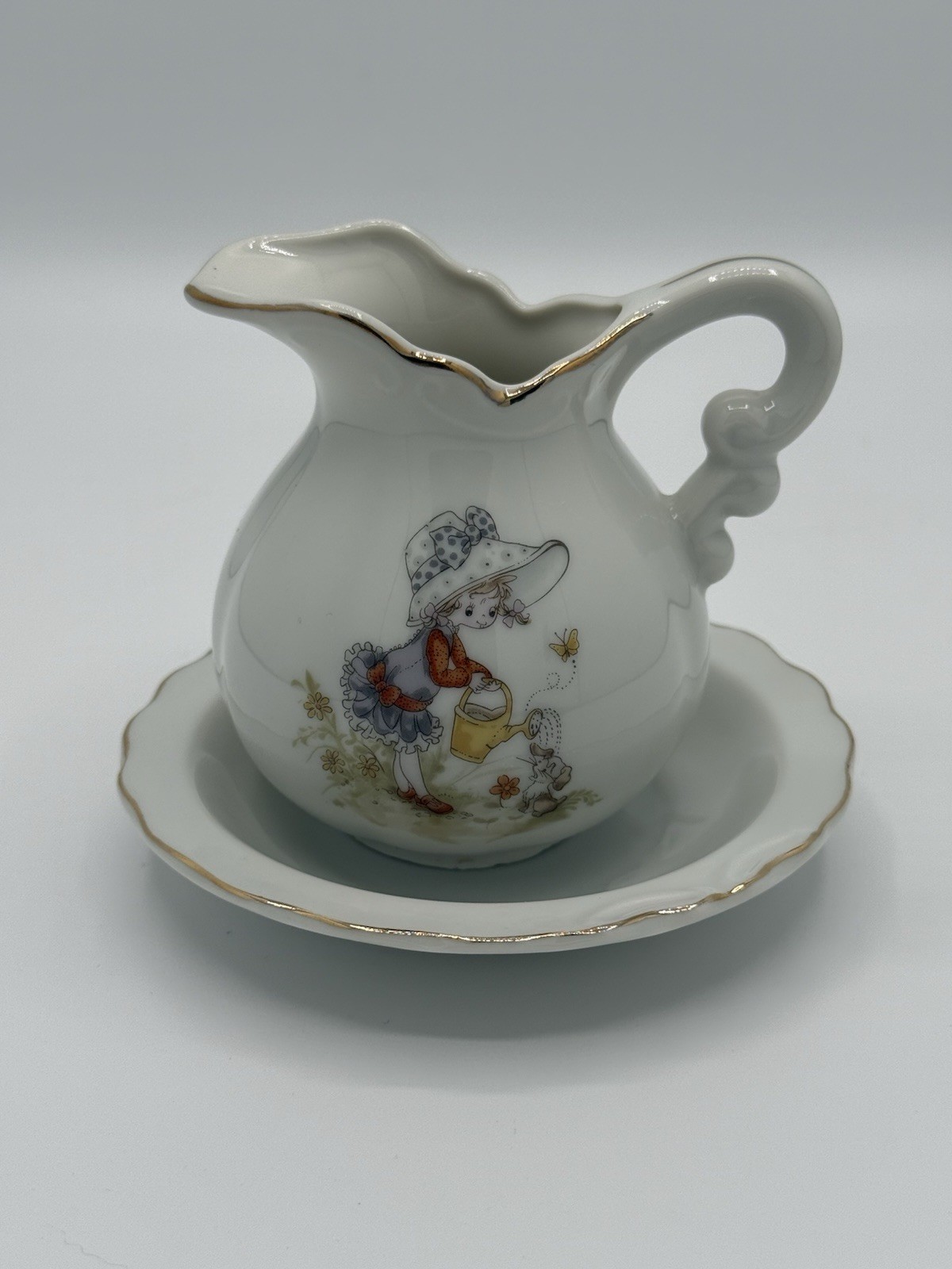 Vintage Porcelain Creamer And Saucer Set With Gold Trim