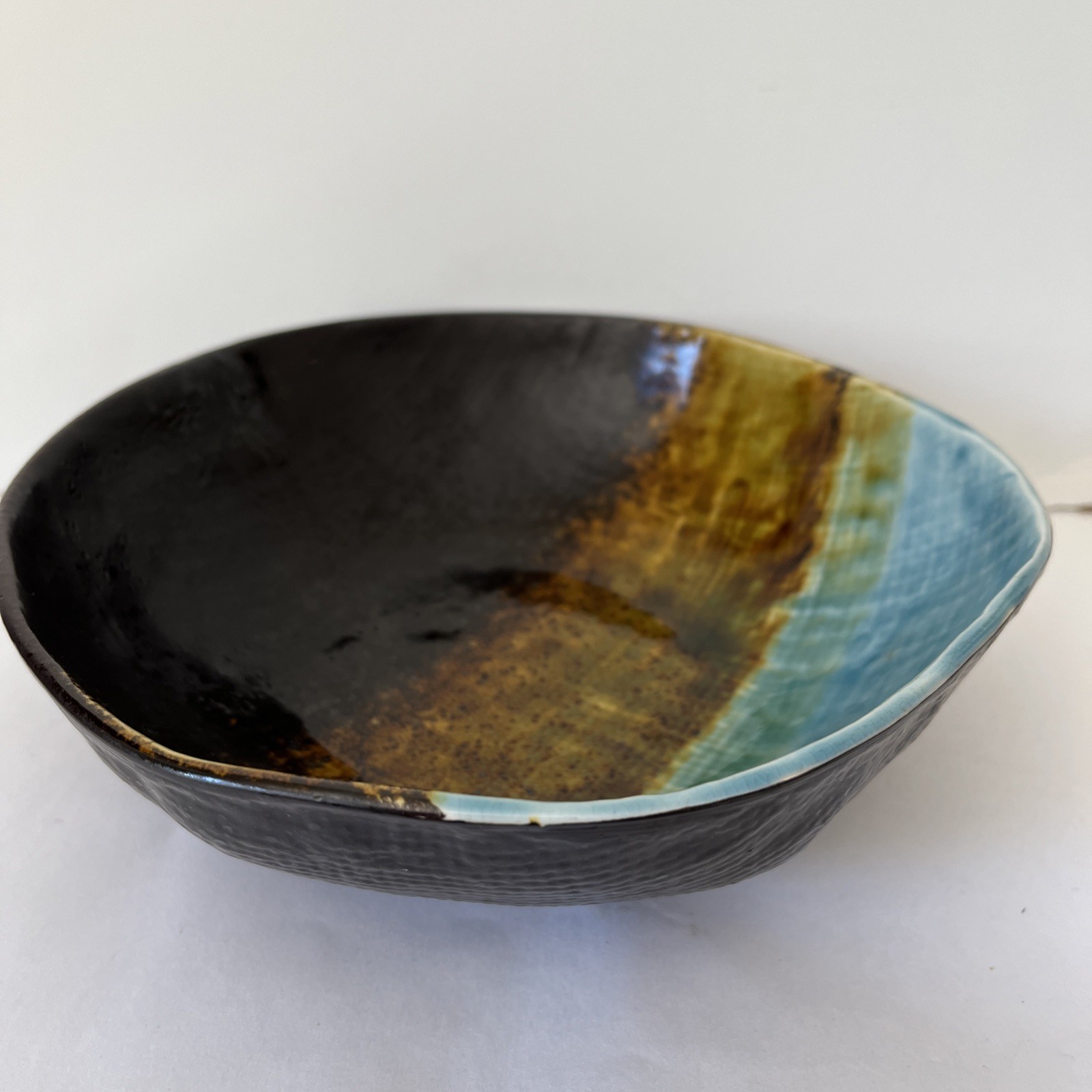 Pier 1 Cassidy asymmetrical bowl -blue and brown crackled, textured glaze