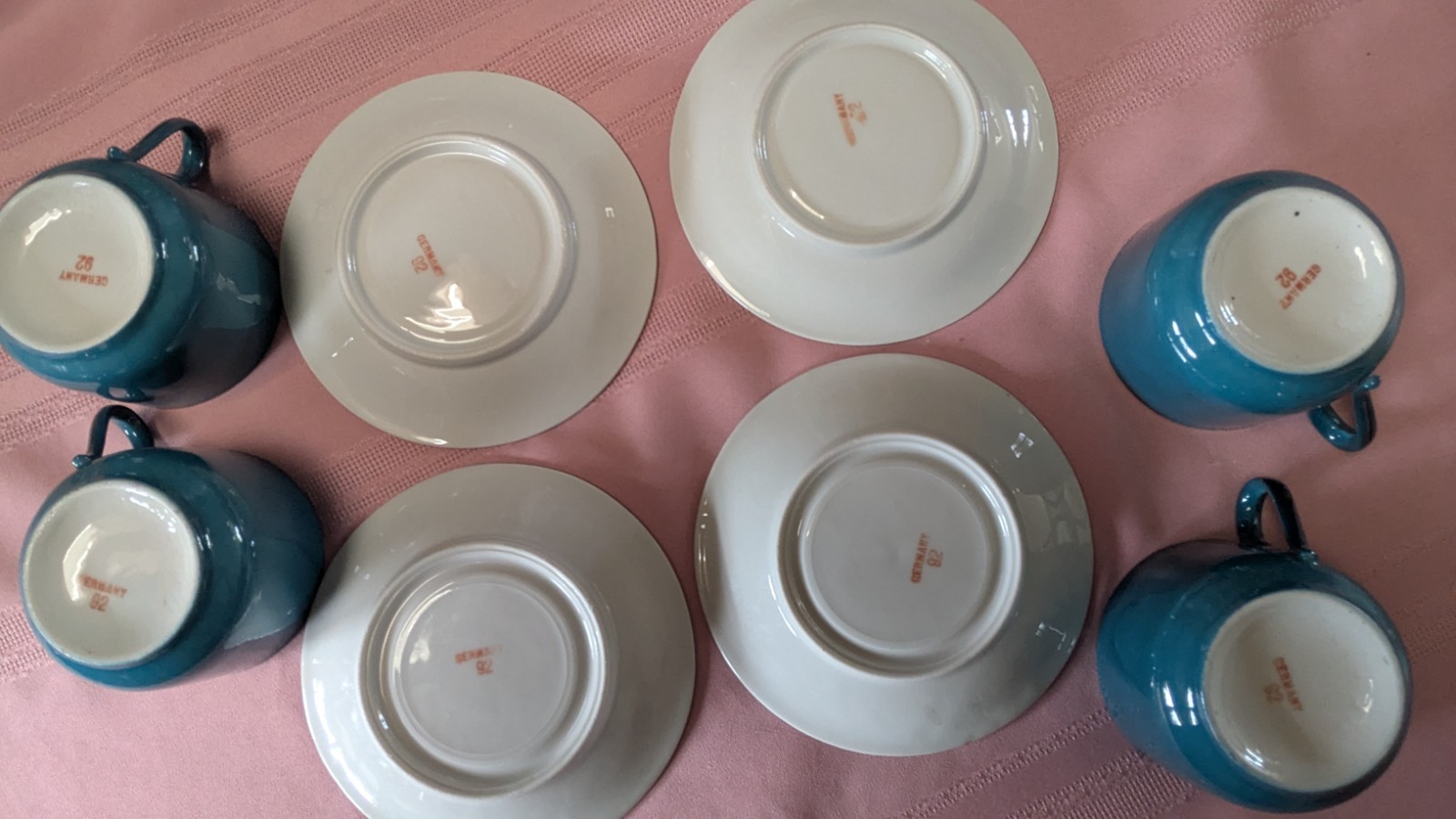 Four piece set cups saucers blue black white Germany