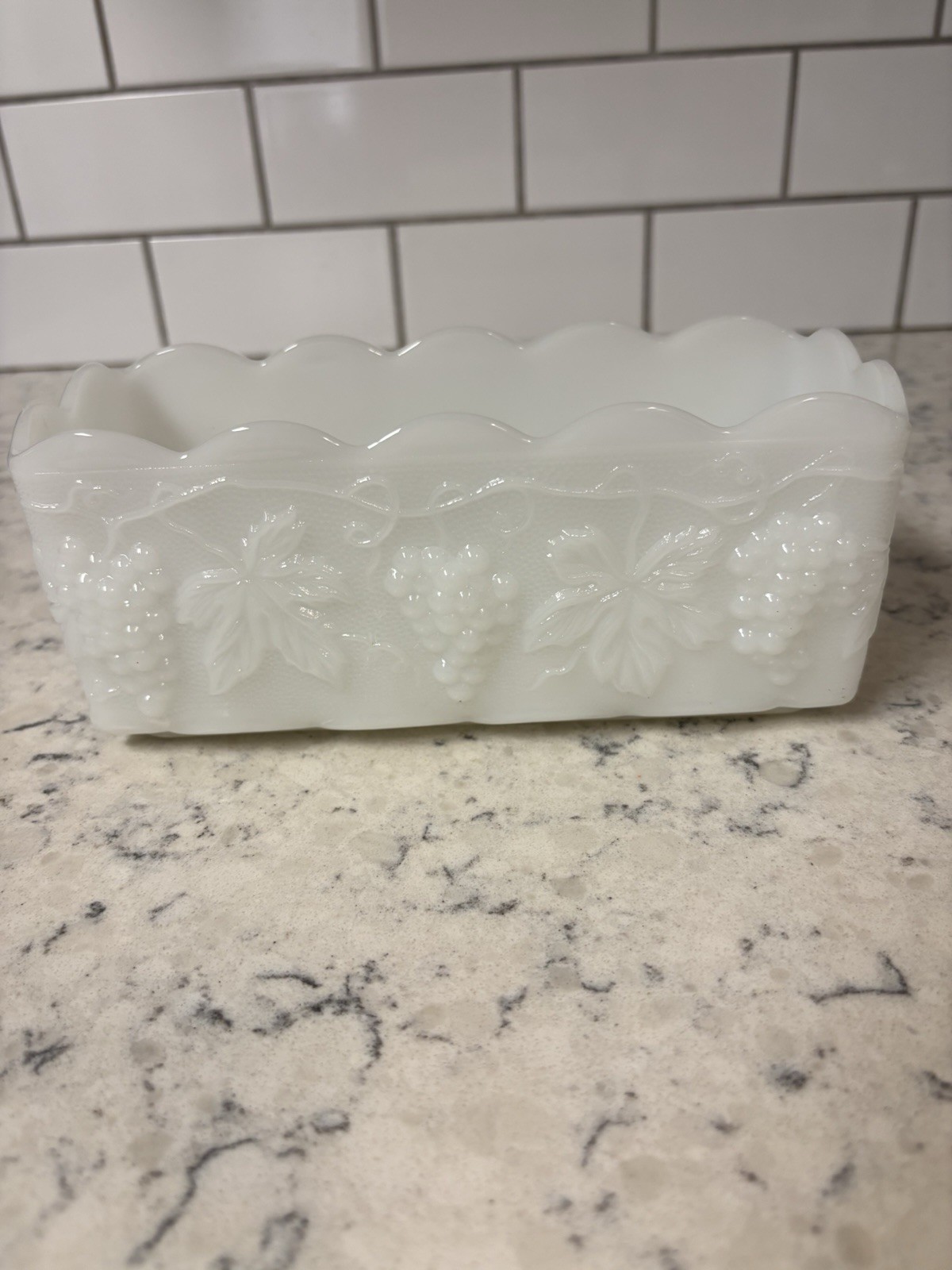Anchor Hocking Fire King milk glass rectangular dish with grape pattern.