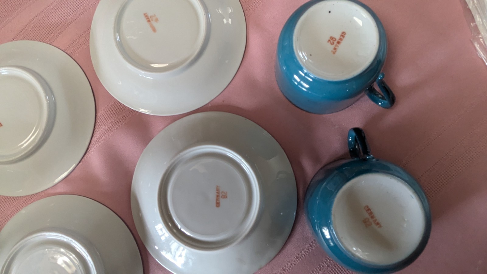 Four piece set cups saucers blue black white Germany