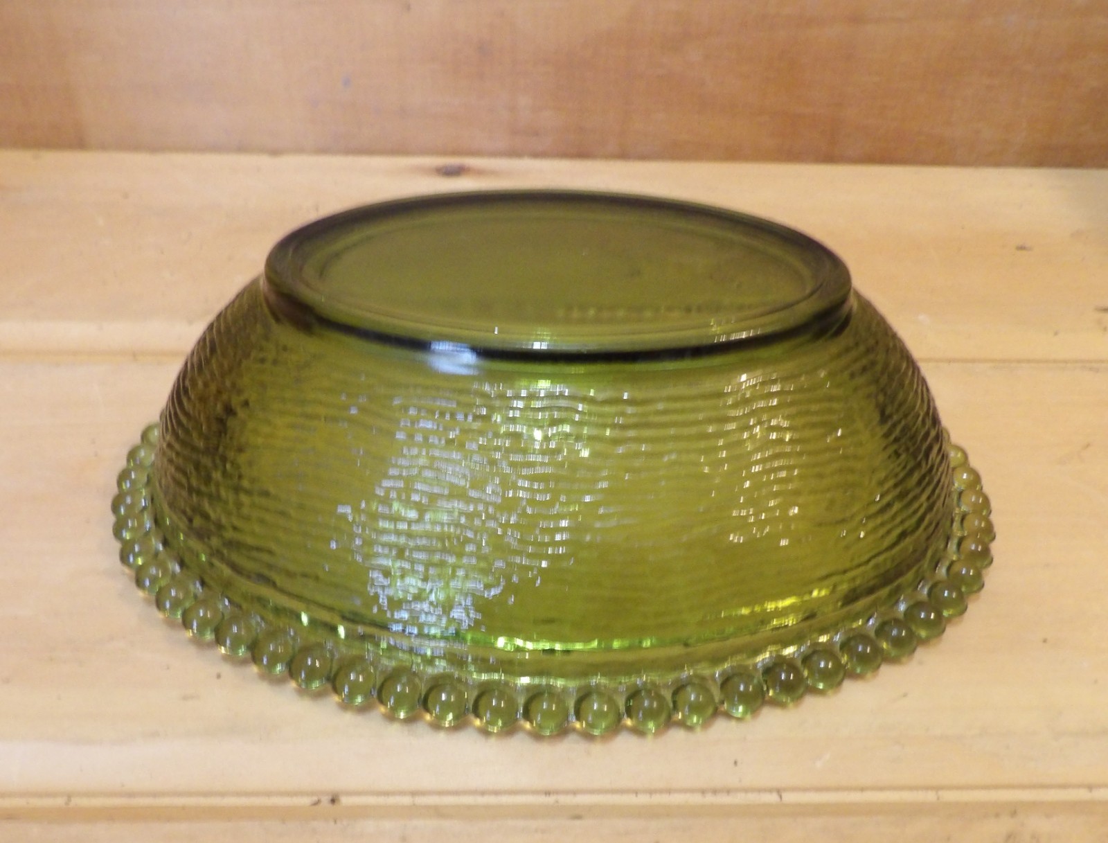 1 Indiana Glass Olive Green Hen on a Nest. 7″L x 5½”W x 5¼”H. There is one Chip