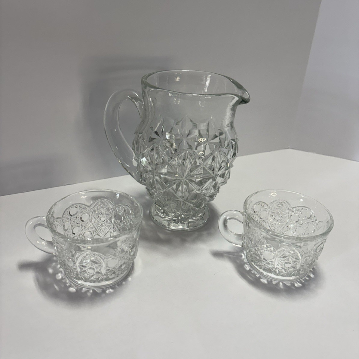Vintage Clear Pressed Glass Pitcher & 2 Cups Cut Glass Style Starburst Pattern